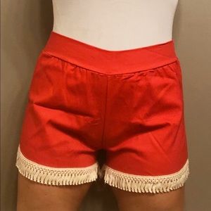 Boutique red fringe shorts with elastic waist